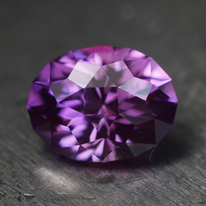 3.07 ct purple plum flame fusion sapphire